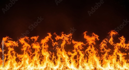 A roaring curtain of fire with a dense wall of orange light and fine glowing sparks