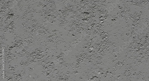 Industrial texture of a worn gray cement floor revealing the underlying stone aggregate and pebbles