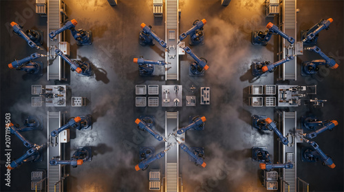 Bild auf Leinwand Symmetrical Aerial View of Robot Arms on Automated Production Line