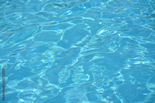 Clear Turquoise Swimming Pool Water with Sunlight Ripples
