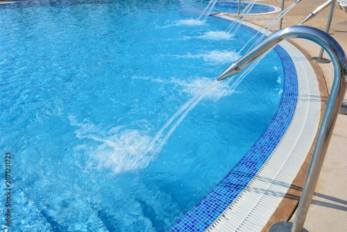 Blue Swimming Pool with Stainless Steel Ladder and Water Jet