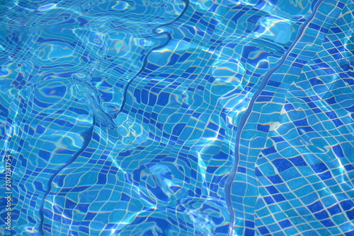 Blue Mosaic Swimming Pool Tiles Under Rippling Water