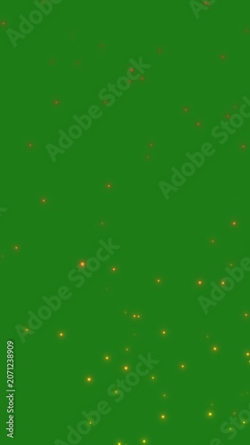 Glowing Orange Fire Sparks Rising on Green Screen. Magical glowing orange and yellow ember particles floating upward against a bright green screen background