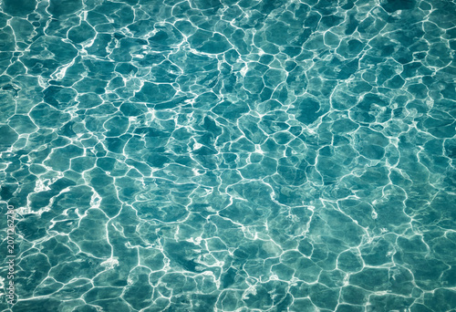 Konstfotografi Crystal clear swimming pool water with sunlight reflections sunlight reflection
