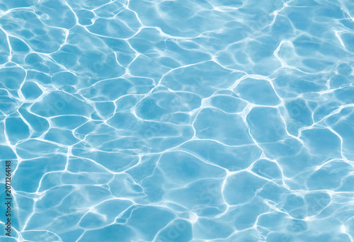 Bright azure swimming pool water surface with sunlight caustics swimming sunlight background abstract refreshing reflection daylight relaxing transparent vacation