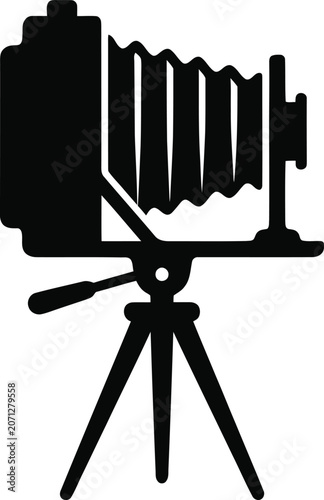 Photography Vintage bellow camera mounted on antique tripod for historic photography