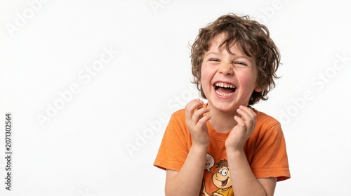 Happy child, smiling kid, laughing boy, joyful expression, orange shirt