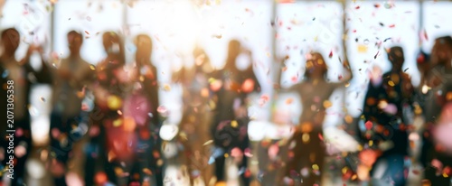 Office workers' party with confetti and people celebrating 