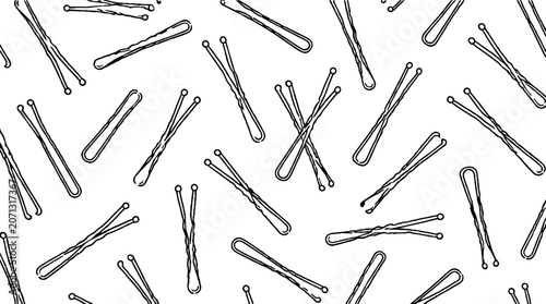 Scattered metal paper clips on white background.