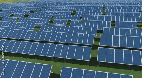 Elevated view of a large-scale solar farm featuring rows of blue photovoltaic panels installed on metal frames over a green field on a clear day for sustainable power generation.