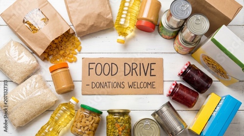 
set of kitchen utensils,set of different spices on a wooden table,Food donations such as pasta, rice, oil, peanut butter, canned food, jam and other on white wooden table , top view
