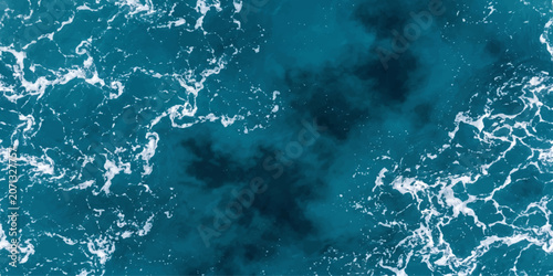 Photos An aerial view of the vast, deep blue ocean, its surface a mesmerizing tapestry of swirling white foam and dark, mysterious depths, evoking a sense of boundless freedom and raw natural power