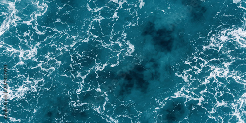 Tableau sur toile Aerial view of the ocean, showing swirling turquoise water and white sea foam