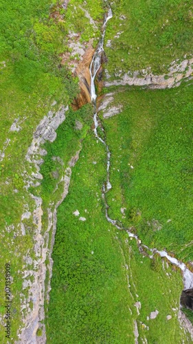 Shaghot Waterfall, Tall Mountain Waterfall Cascading Through Rocky Alpine Gorge 