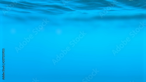 Underwater View of Blue Ocean Surface with Gentle Ripples and Light