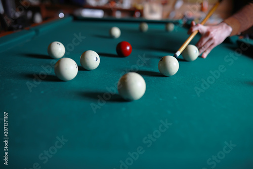 Fotografie Russian billiard balls, cue, triangle, chalk on a table Green cloth Copy space