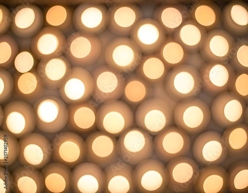 Warm golden light bokeh background texture.