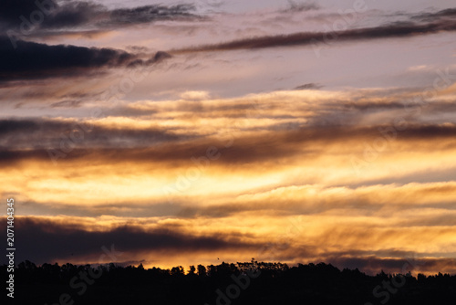 Golden cloud layers in the dusk sky