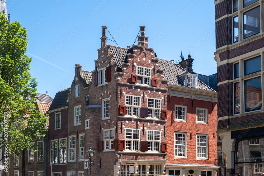 Naklejka premium Ornate Delft City Hall facade under blue sky in Delft city centre, Netherlands