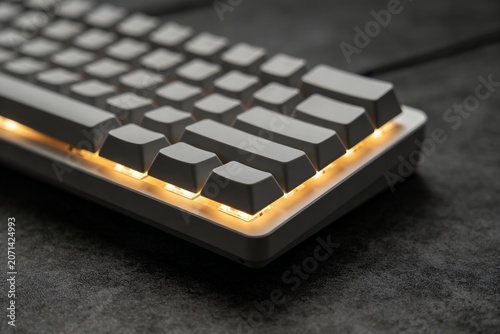 keyboard. Close-up of a custom mechanical keyboard with matte grey keycaps and warm backlight. professional coding blogs, remote work aesthetics, designed for modern technology wallpapers.