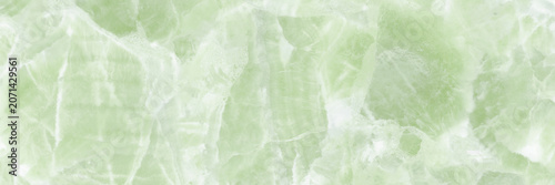 Soft green marble texture background with translucent crystal patterns and de...