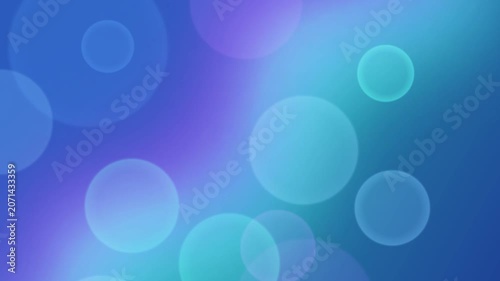 Vibrant bokeh lights dance across a serene blue and purple gradient background