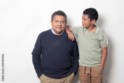 Latino single dad and his 12-year-old Latino son show their love to celebrate Father's Day