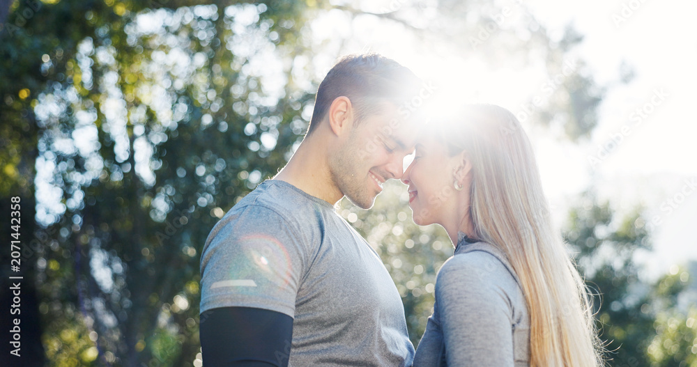 Fototapeta premium Fitness, nature and couple with forehead touch for exercise, bonding and support for morning workout. Happy, flare and man with woman for affection outdoor in park for sports, active or health,