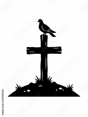 Silhouette of a Bird Perched on a Wooden Cross on a Hill