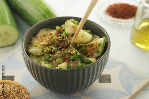 A bowl with Korean cucumber salad Oi Muchim	