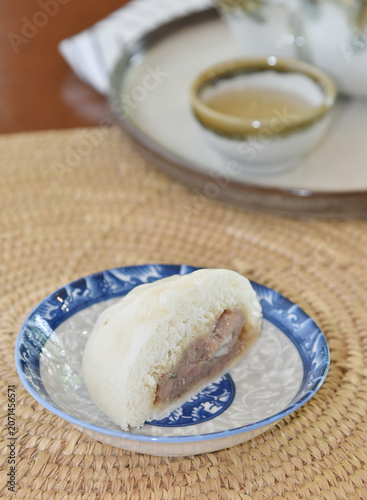 Chinese bun with a bite mark