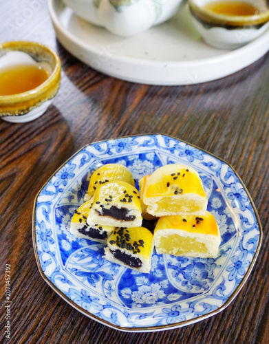 Sliced Chinese pastry in blue dish, Vintage dessert