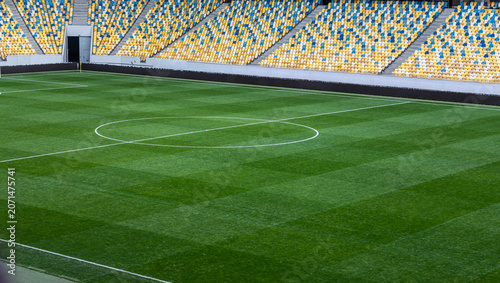 Grass soccer field in Lviv oblast Ukraina ready for an exciting match with vibrant grandstands and well-manicured turf
