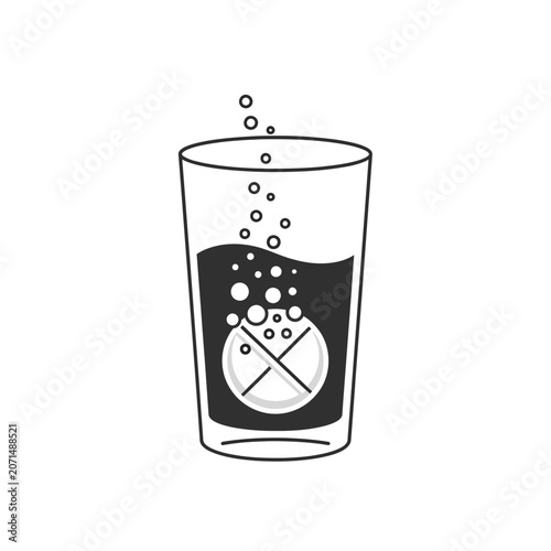 Glass with fizzy drink and tablet.