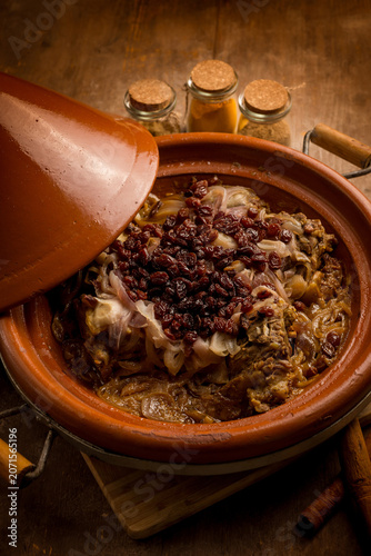 traditional moroccan lamb tajine with onions and dried grapes