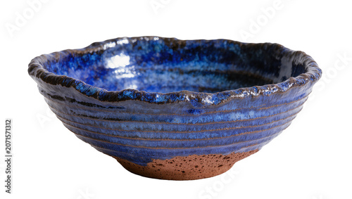 Handcrafted rustic blue ceramic bowl with textured rim, isolated on transparent background