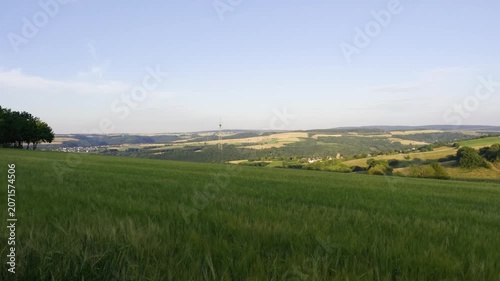 Scenic Rolling Hills and Fields in Rural Landscape at Sunset