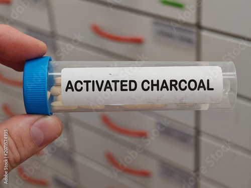 Cuadro en lienzo Box of ACTIVATED CHARCOAL tablets on a hospital pharmacy table used to treat poisoning and gas a gastrointestinal adsorbent