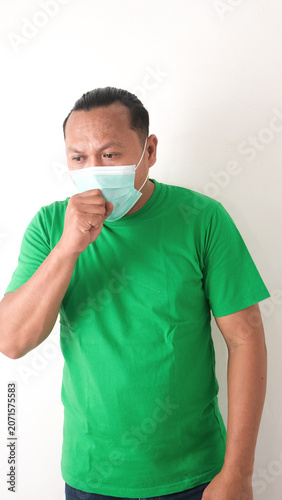 health problem and people concept - unhealthy asian man coughing, isolaited white background