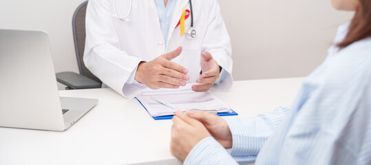 World hepatitis day awareness month, 28 July. Doctor and patient having medical consultation for Red and Yellow ribbon for Liver cancer, Jaundice, Cirrhosis, Failure, Enlarged, Hepatic Encephalopathy