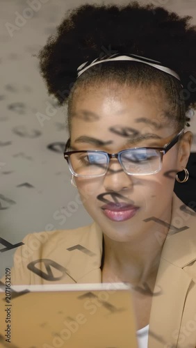 Vertical video: Woman raising hands adjusting glasses leaning studying IT tablet as symbols on face