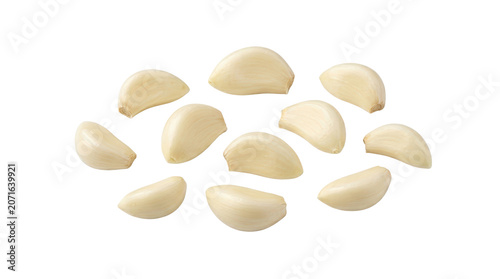 Freshly peeled garlic cloves on white background.