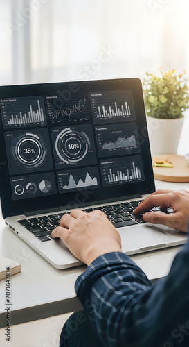 Person analyzing business dashboard on laptop