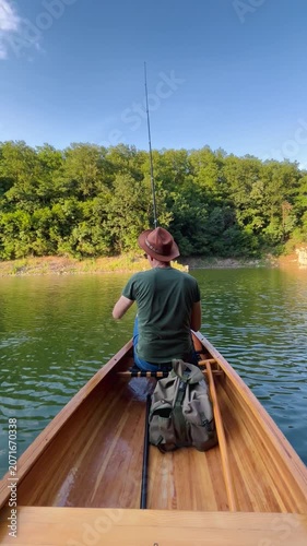 Man fishing on calm lake