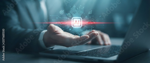 Businessman interacting with artificial intelligence digital chip interface while working on a laptop