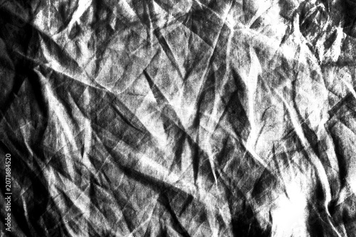 Heavily crumpled fabric texture in black and white. High contrast linen overlay with deep folds and shadows for photo editing, backgrounds, and displacement maps. Transparent PNG.