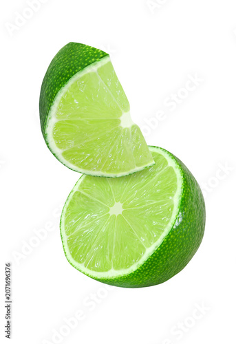 hanging, falling and flying piece of lime fruits isolated on white background with clipping path