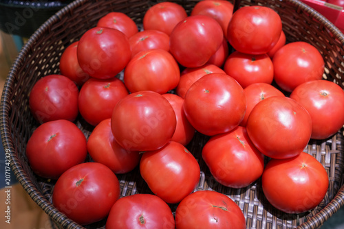 Tomatoes in a basket at a supermarket in Japan.