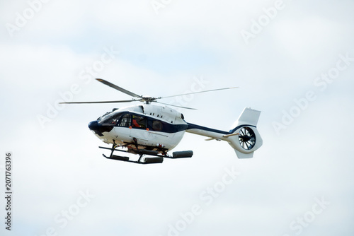 Cuadro en lienzo Civil Protection Search and Rescue Helicopter Flying Against Bright Sky, Concept
