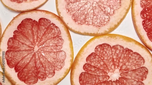 Top view of transparent sliced grapefruit, citrus fruits, showing colorful medley perfect for healthy eating and dietary concepts, inviting freshness and vitality, close up